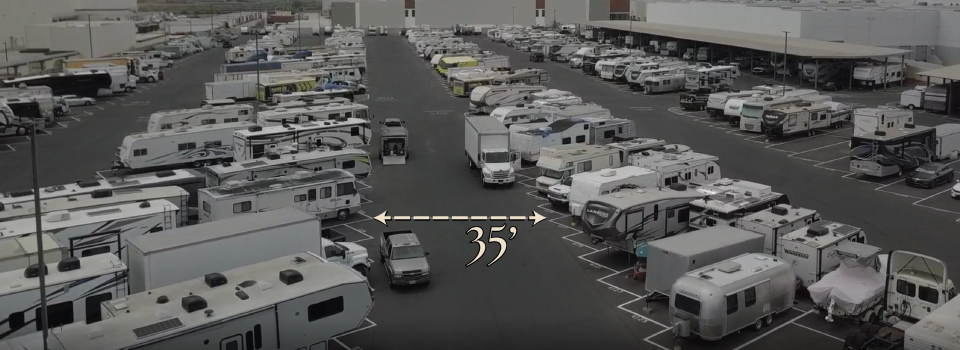 Measurement graphic showing an approximately 35-foot drive aisle between RV storage rows